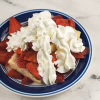 strawberry shortcake on blue rimmed plate