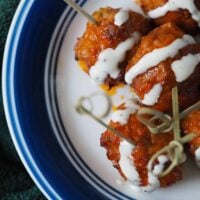 buffalo meatballs on blue rimmed plate