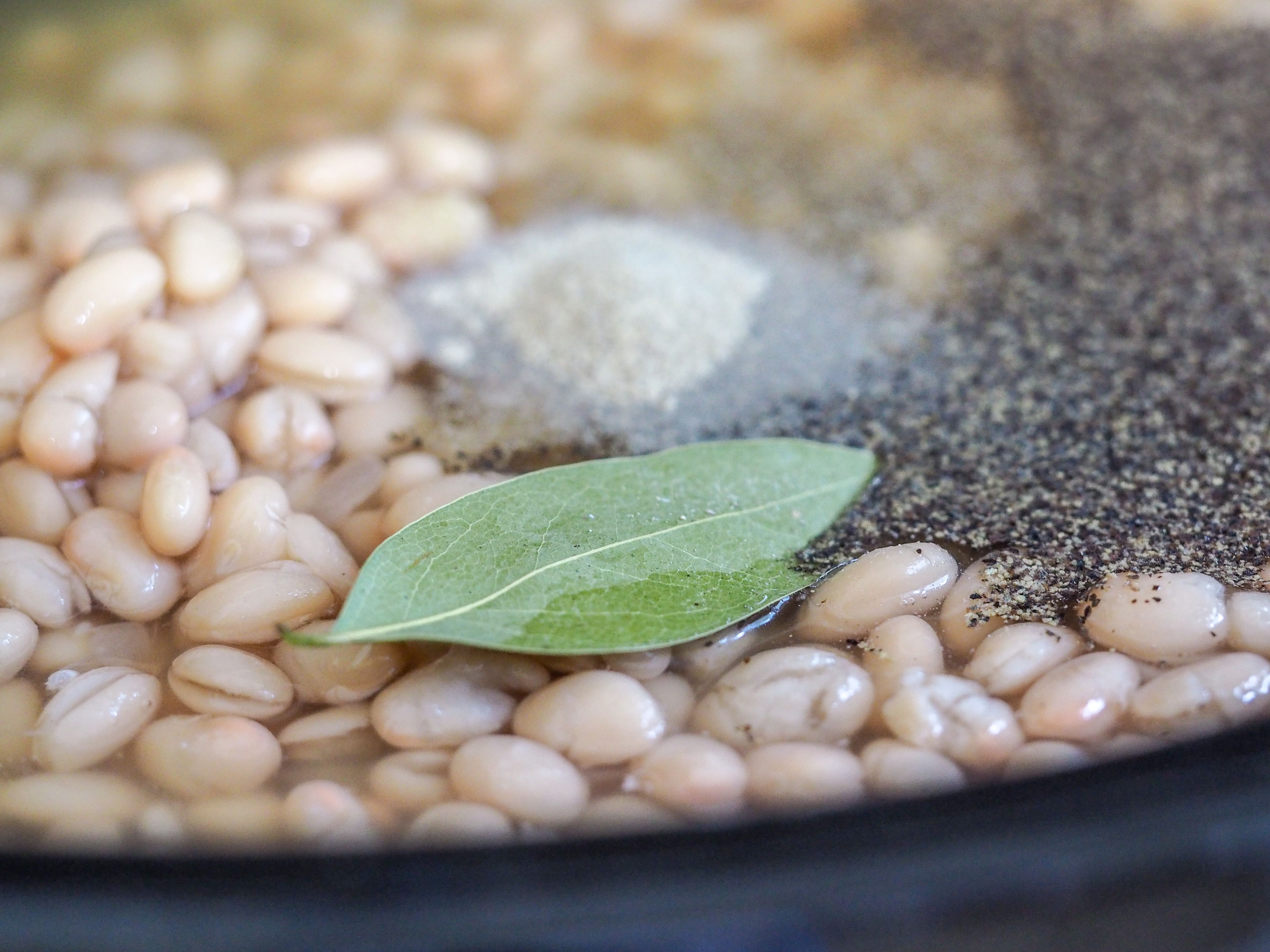 close view of navy bean soup mixture in crockpot