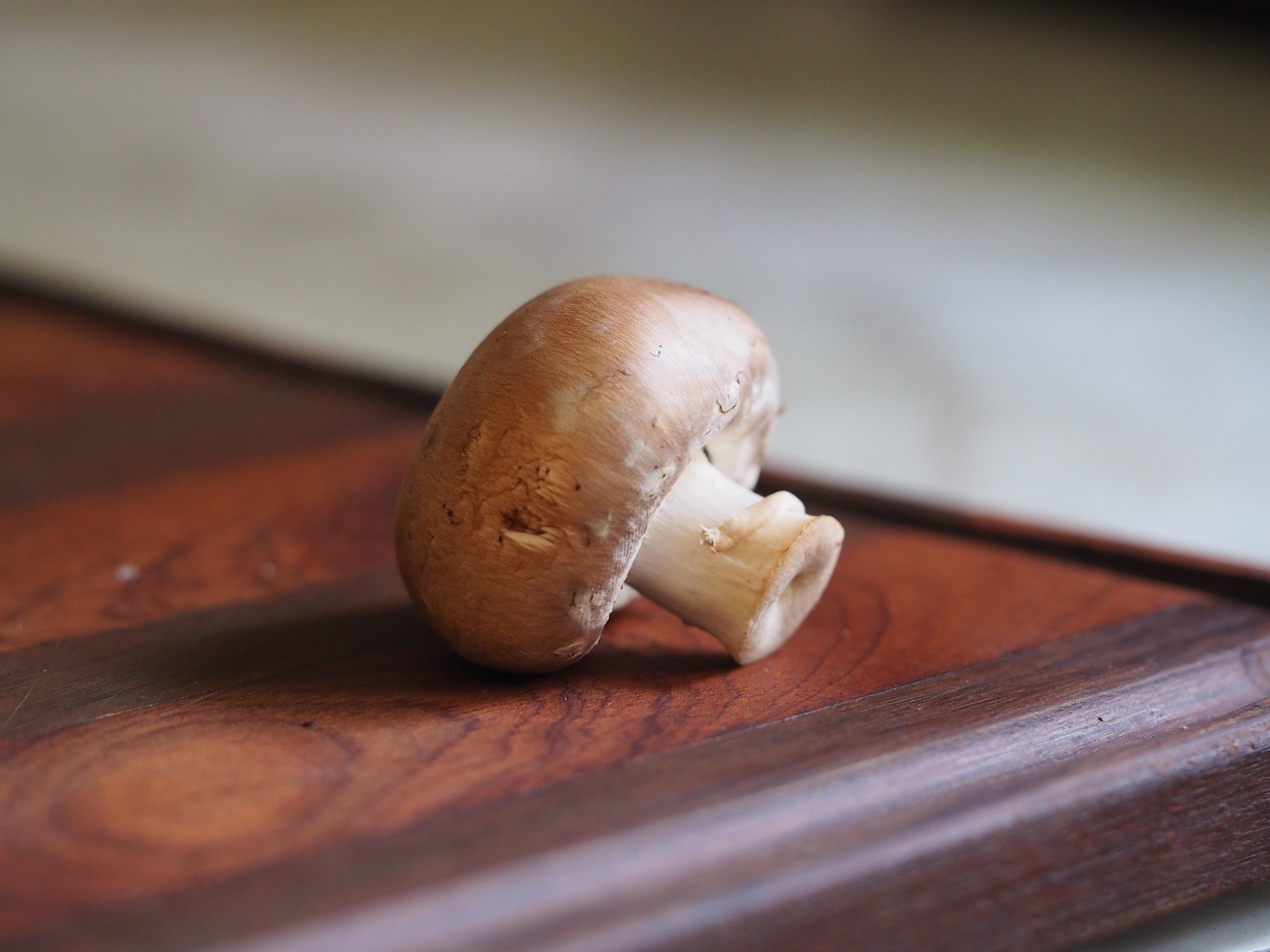 bella mushroom on a cutting board