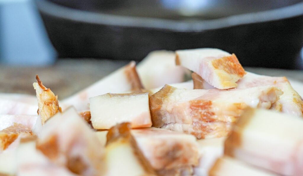 diced jowl bacon on wooden cutting board