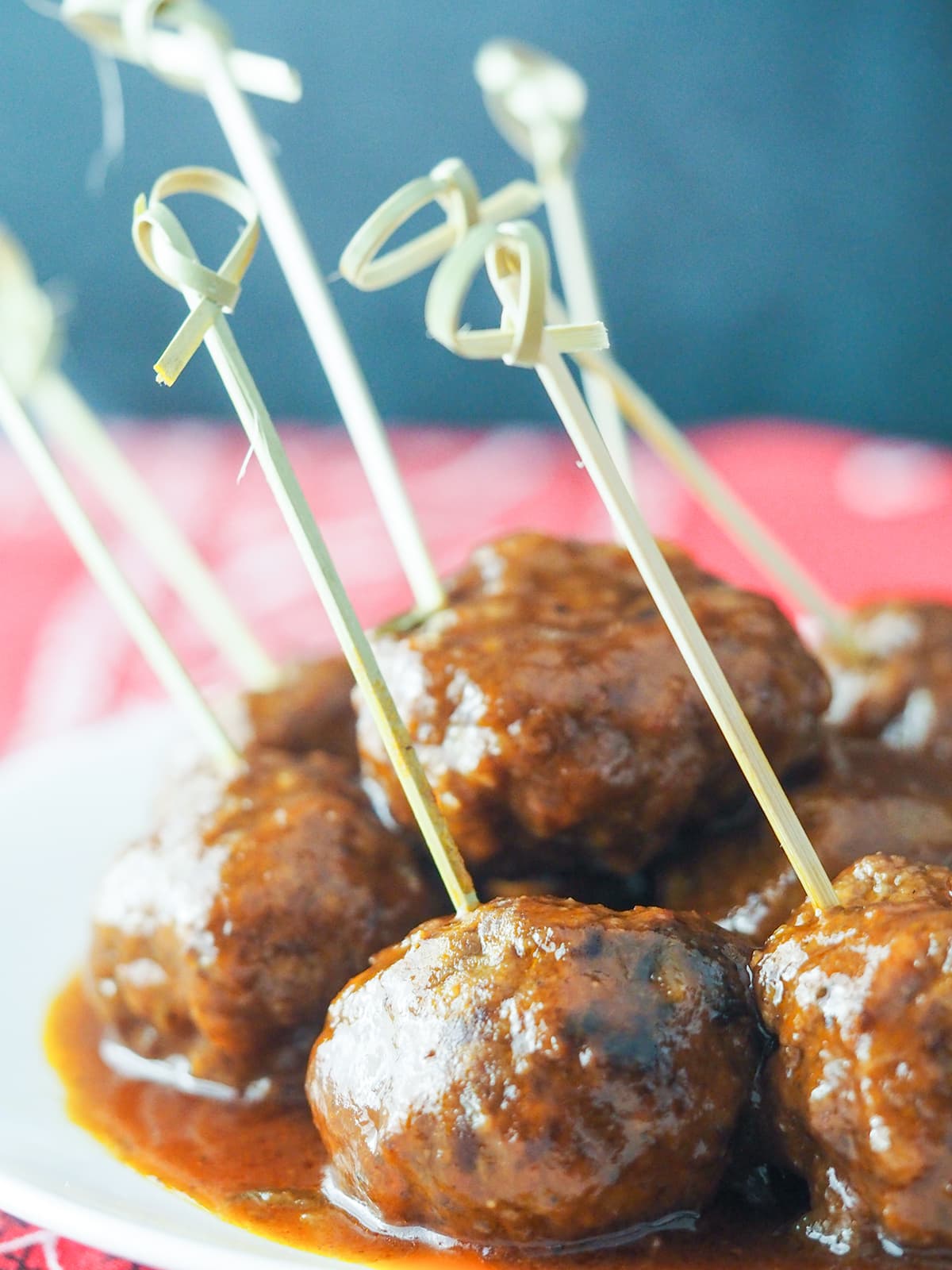 meatballs on plate on red background