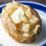 baked potato on blue rimmed plate
