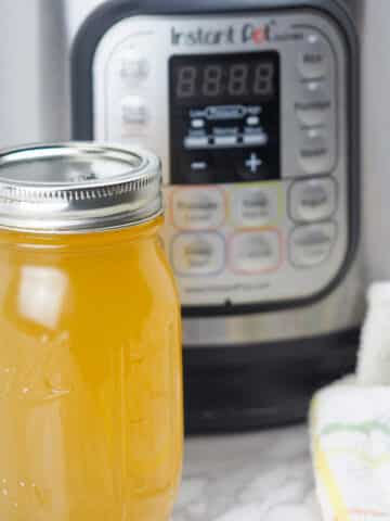 bone broth on counter with pressure cooker