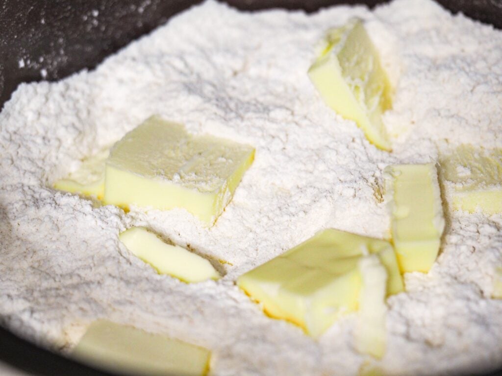 close view of scone flour mixture and cut butter pieces