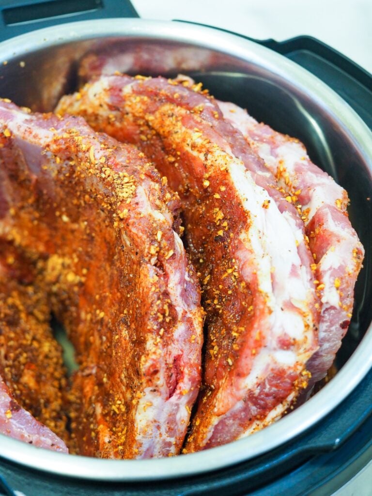 ribs standing up in the Instant Pot for cooking