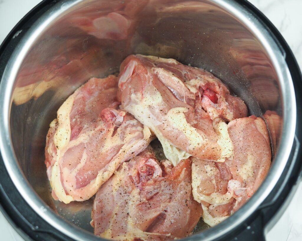 chicken skin side down in Instant Pot frying on saute