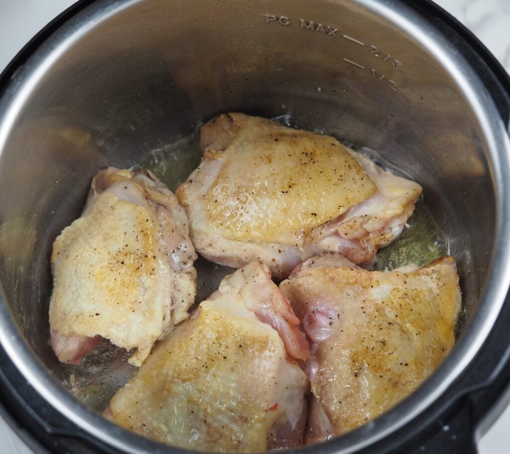 sauteeing chicken thigh pieces skin side up in pressure cooker