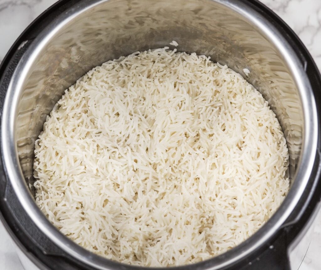 overhead view of cooked coconut rice in pressure cooker