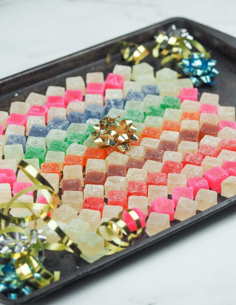 hard tack candy arranged in a mosaic pattern on baking sheet