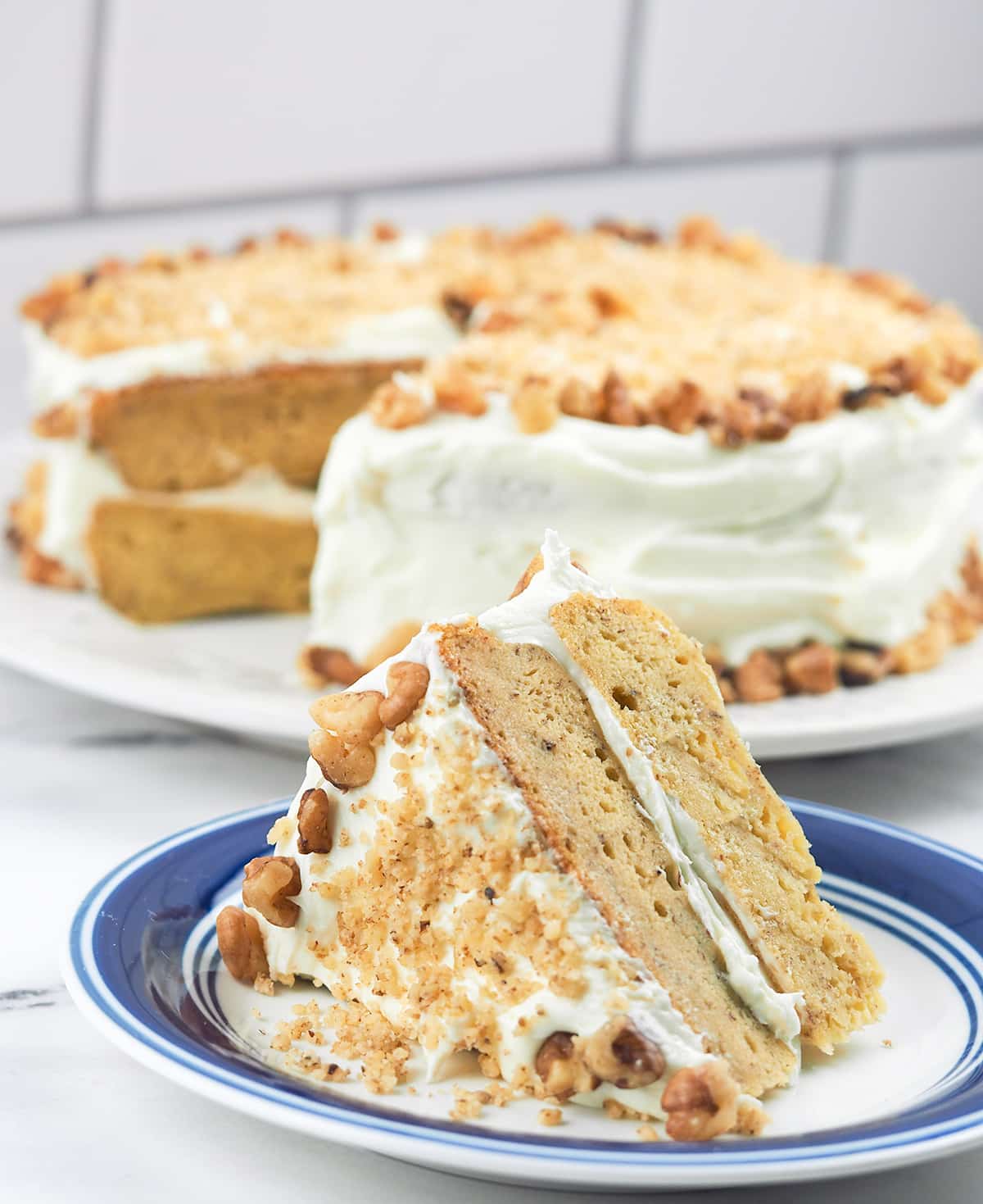 sliced cake on blue rimmed plate on counter