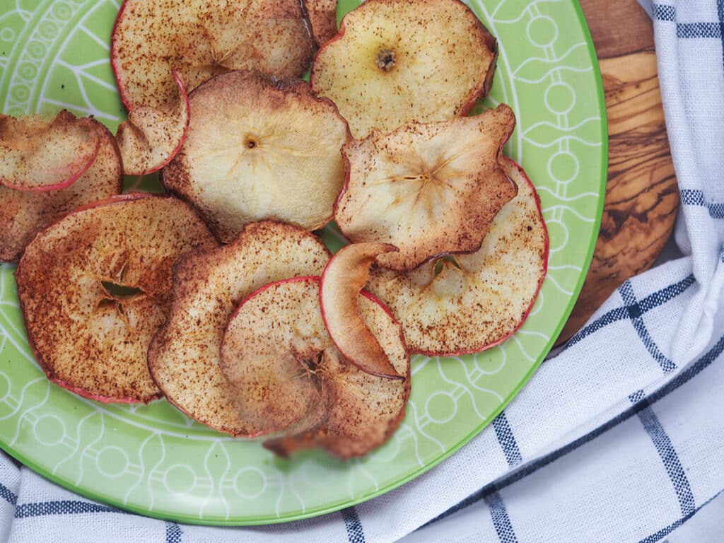 apple chips on green plate