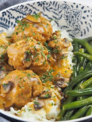 chicken meatballs in bowl with green beans
