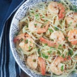 pasta in bowl topped with shrimp scampi