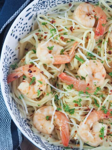pasta in bowl topped with shrimp scampi