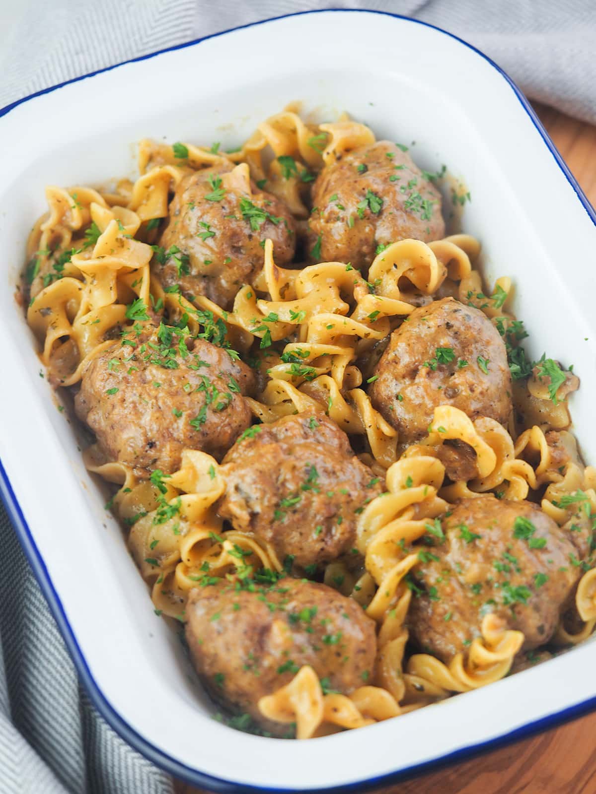 meatballs and gravy in white serving dish