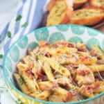 chicken pasta with sun dried tomatoes in bowl