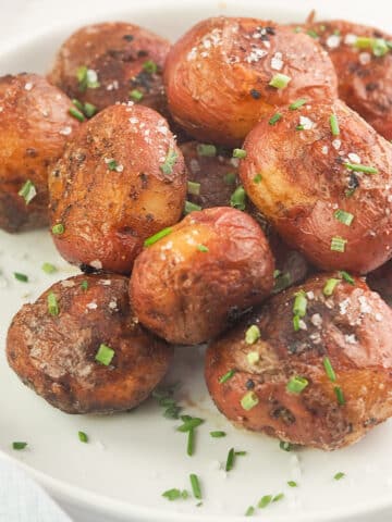 roasted potatoes topped with kosher salt and chives