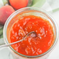 apricot jam in jar with spoon