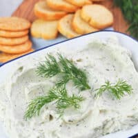 boursin cheese on platter with crackers