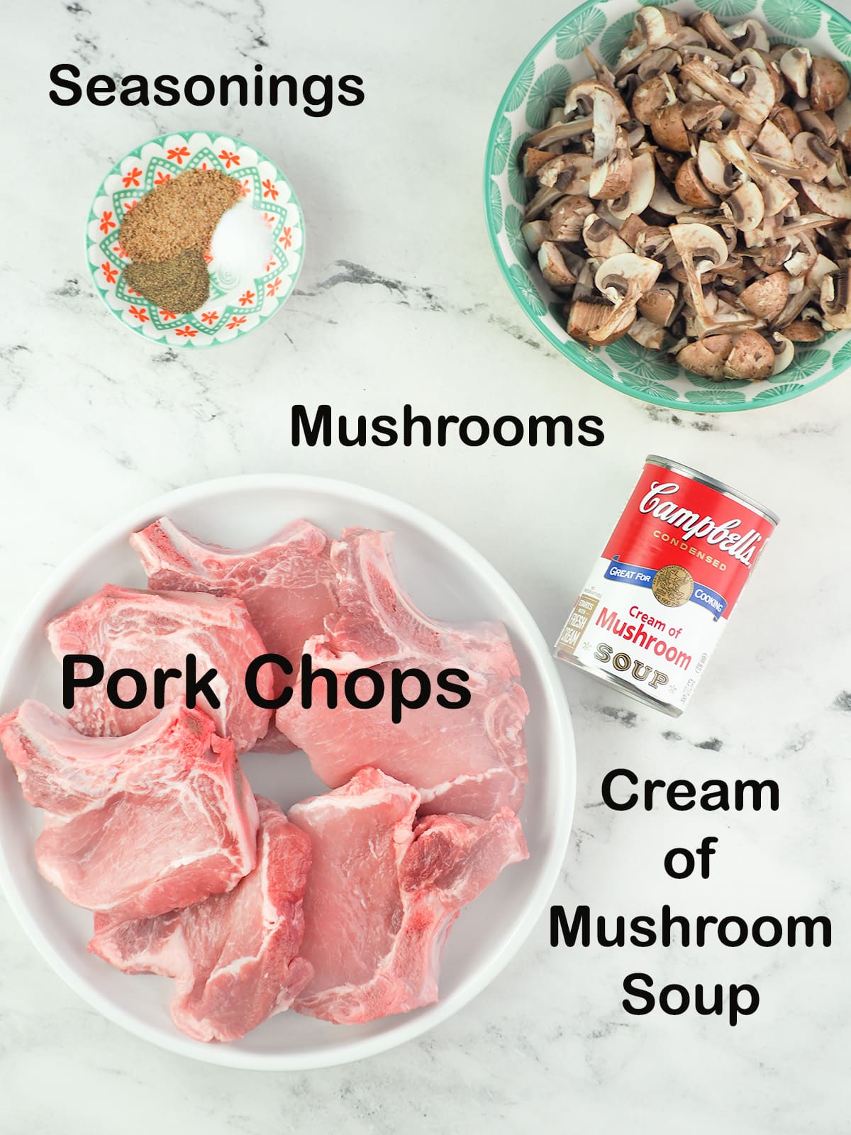 Ingredients for cream of mushroom pork chops: pork chops, a can of cream of mushroom soup, salt, pepper, Everglades seasonings, and sliced mushrooms.