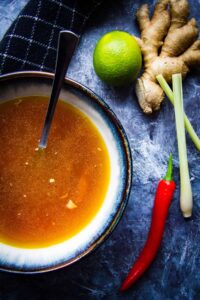 Lemongrass chicken broth with fresh pepper and ginger root.