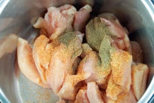 add chicken and seasoning to pot