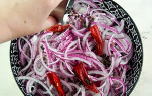 add the black peppercorns