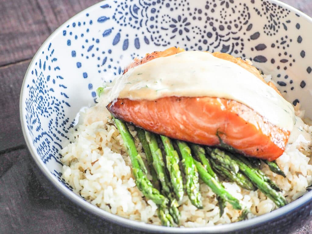 smoked salmon in bowl with dill sauce