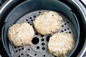 spray basket with oil add the patties